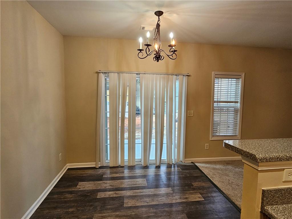2160 Spikerush Way Buford, GA 30519 - Photo 5 of 29 a view of a livingroom with wooden floor and staircase