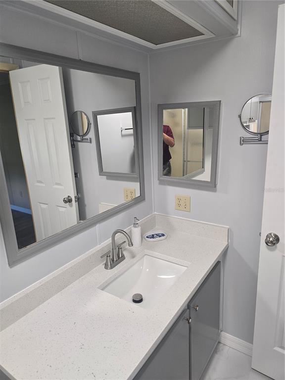 1705 Kiley Court The Villages, FL 32159 - Photo 11 of 20 a bathroom with 2 sink and a mirror