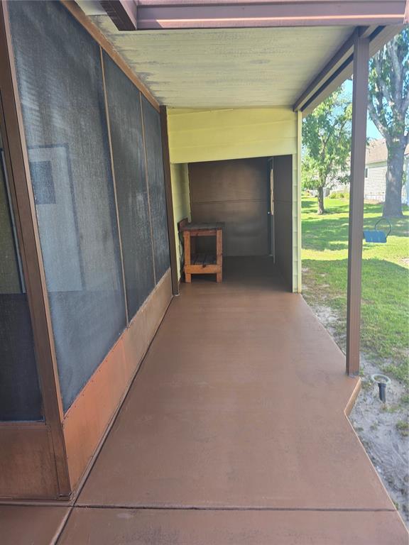 1705 Kiley Court The Villages, FL 32159 - Photo 18 of 20 a view of an empty room with a fireplace and a floor to ceiling window