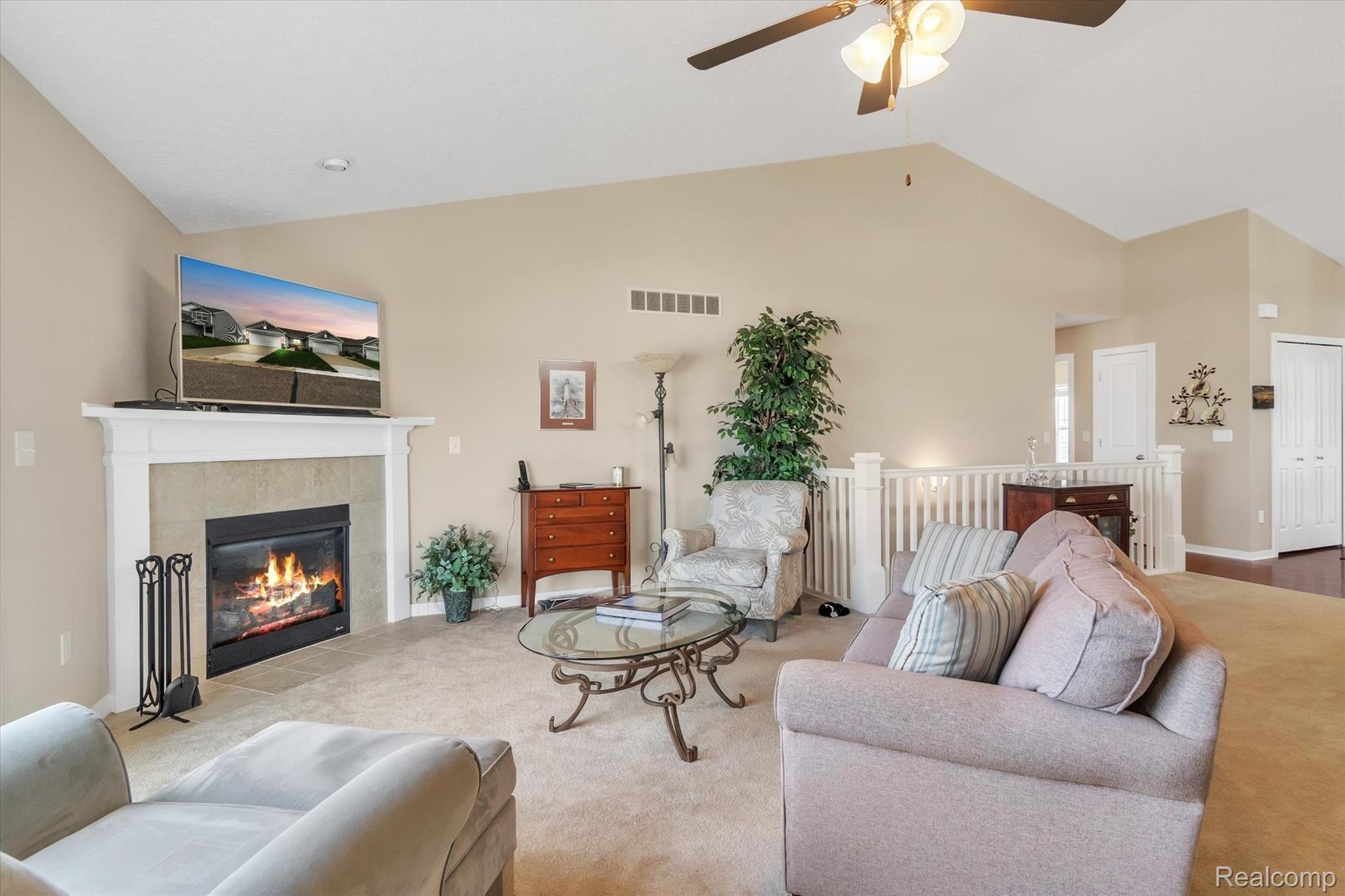 905 Spirea Howell, MI 48843 - Photo 9 of 35 Vaulted ceilings make this room feel even bigger!