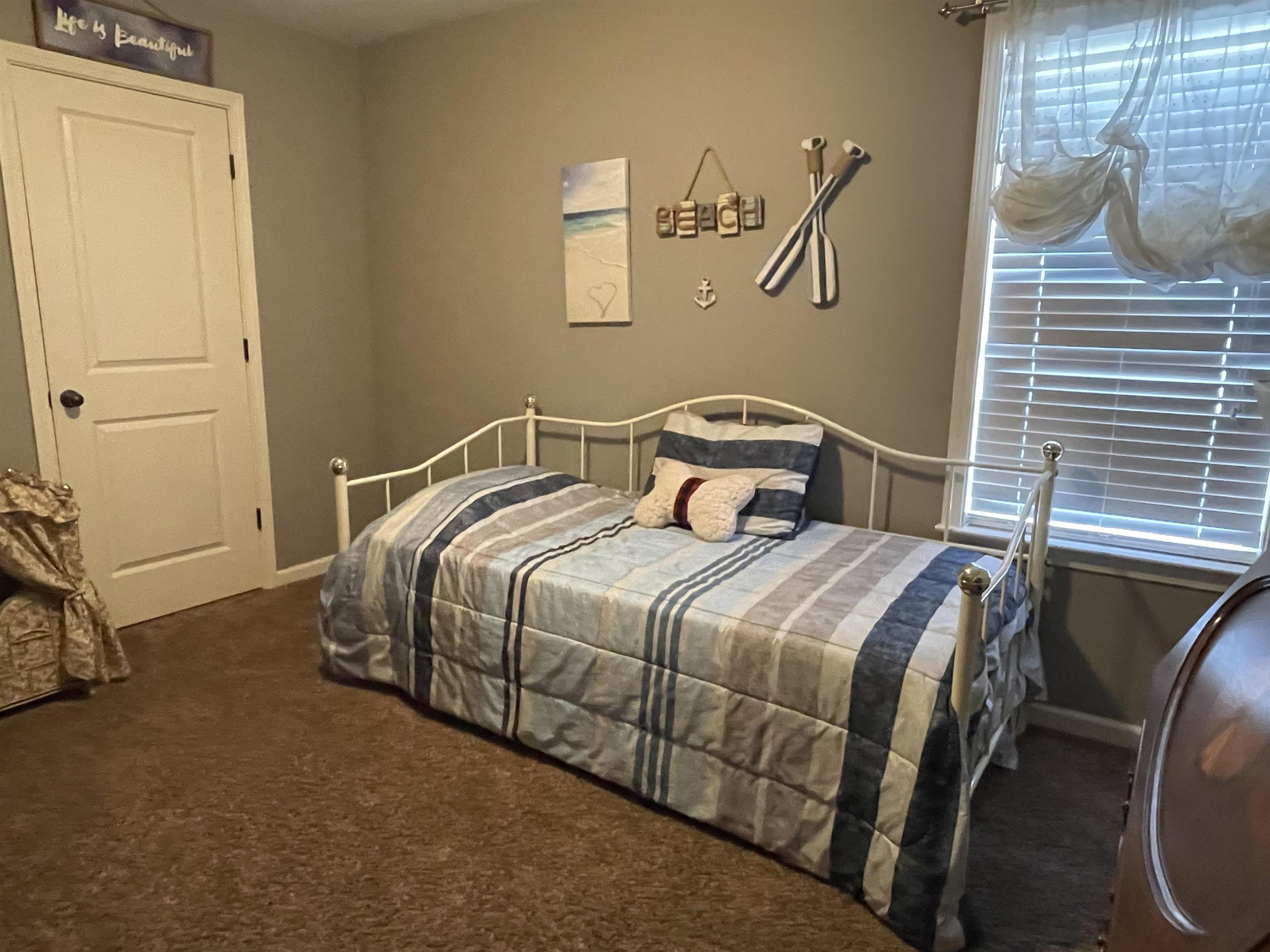 60 Mulberry Cove Oakland, TN 38060 - Photo 14 of 20 a bedroom with a bed and dresser