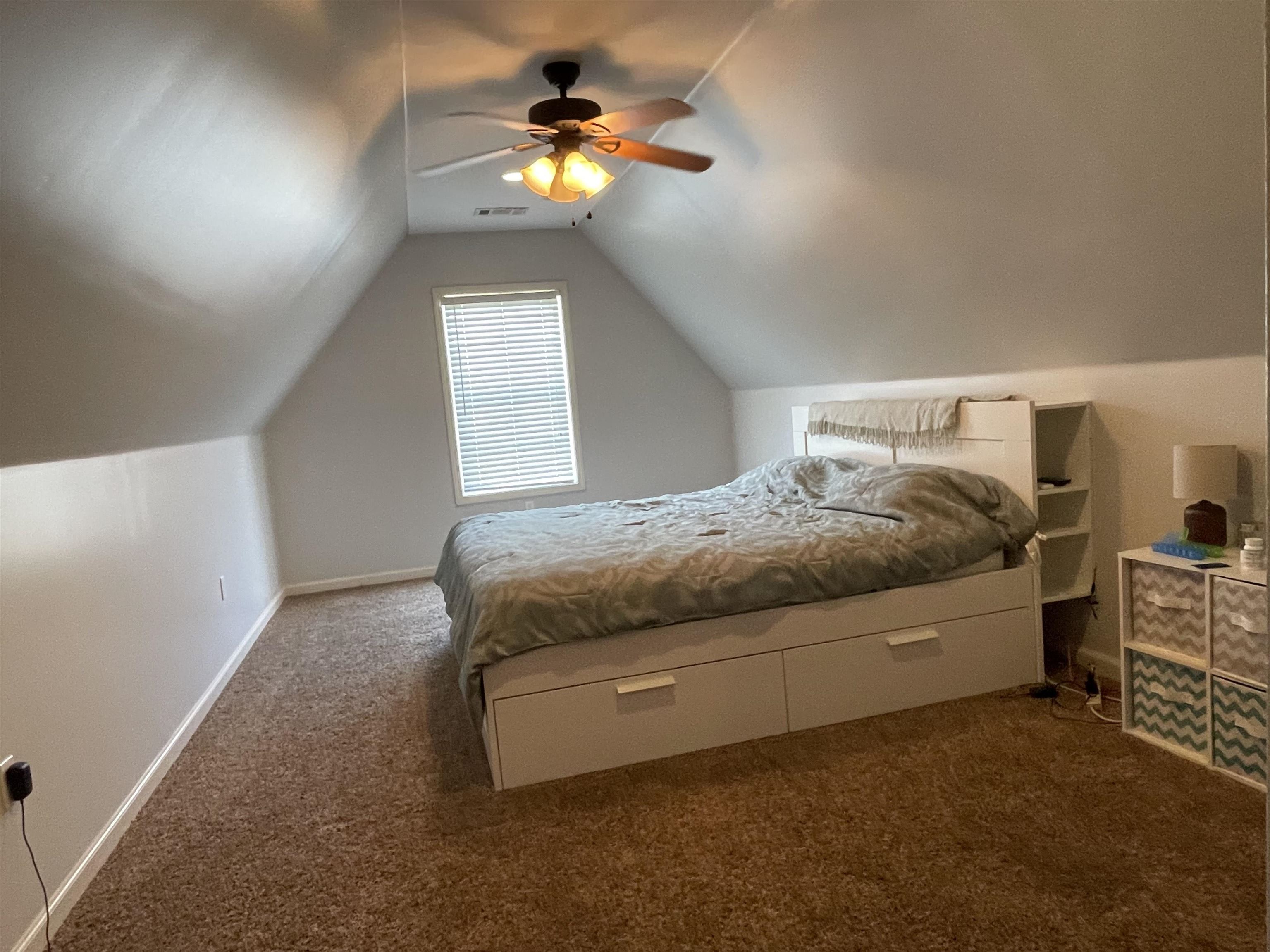 60 Mulberry Cove Oakland, TN 38060 - Photo 15 of 20 a bedroom with a bed and a chandelier