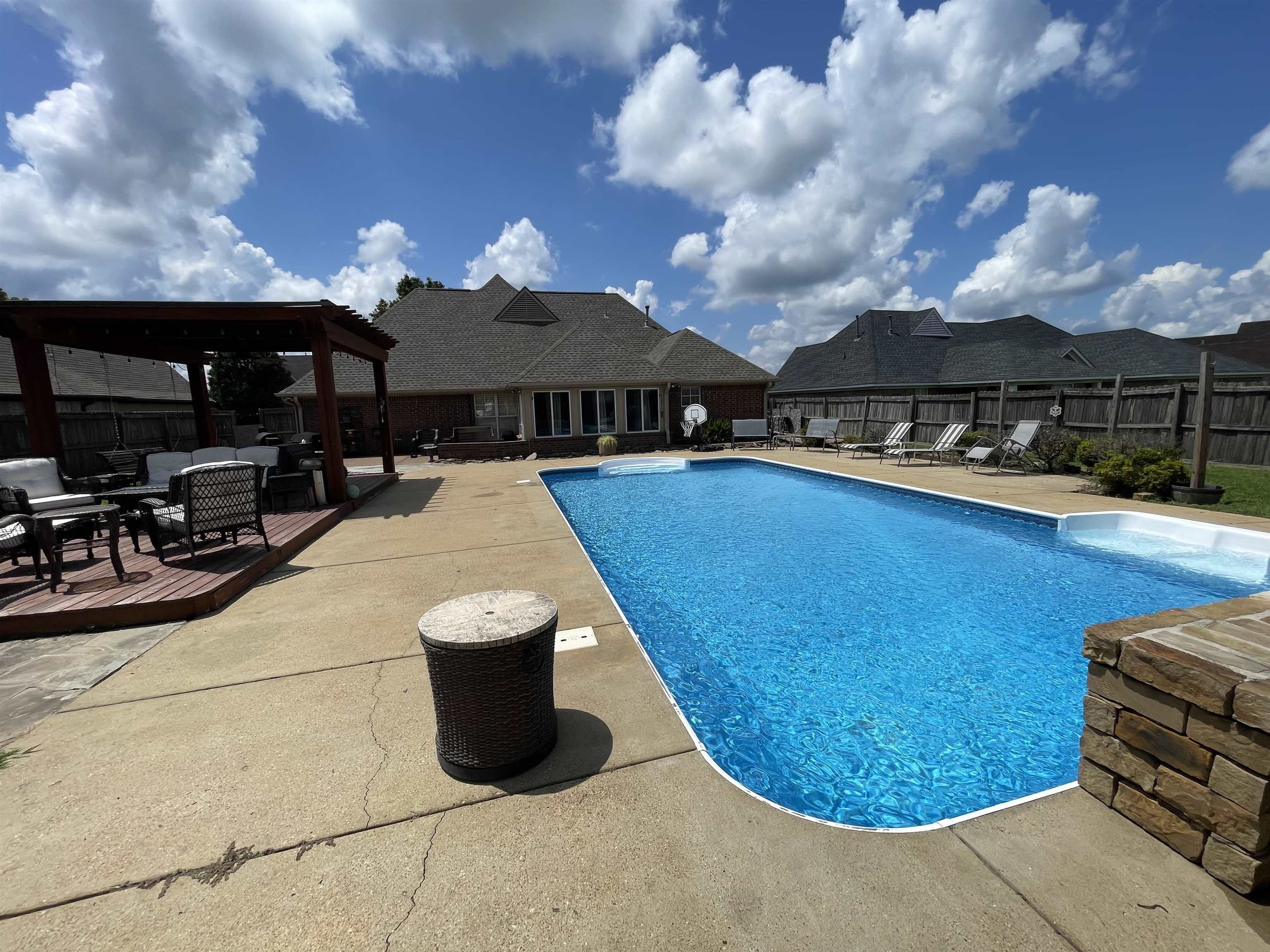 60 Mulberry Cove Oakland, TN 38060 - Photo 20 of 20 a view of a swimming pool with a patio and a yard