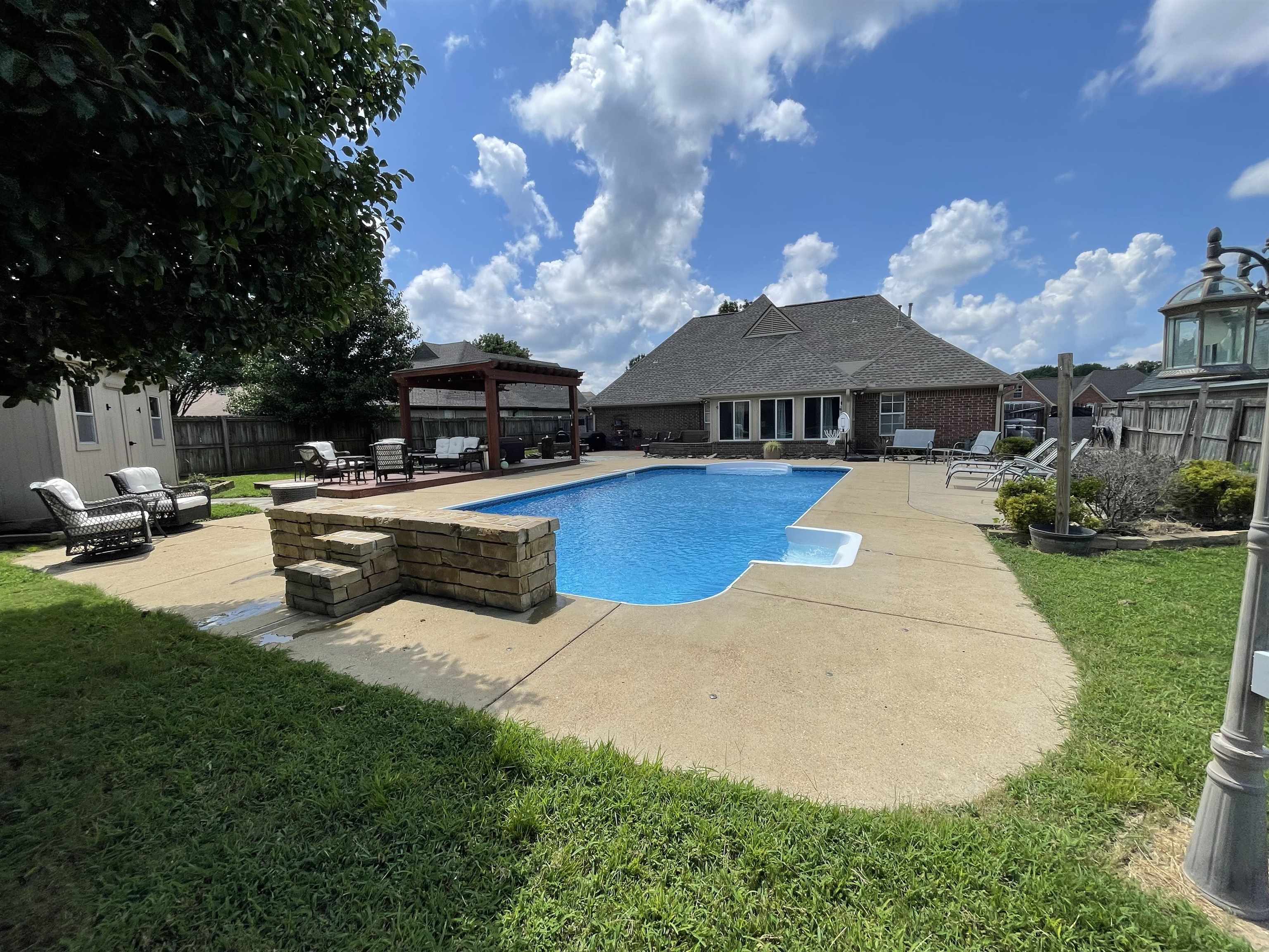 60 Mulberry Cove Oakland, TN 38060 - Photo 2 of 20 a view of a patio with swimming pool