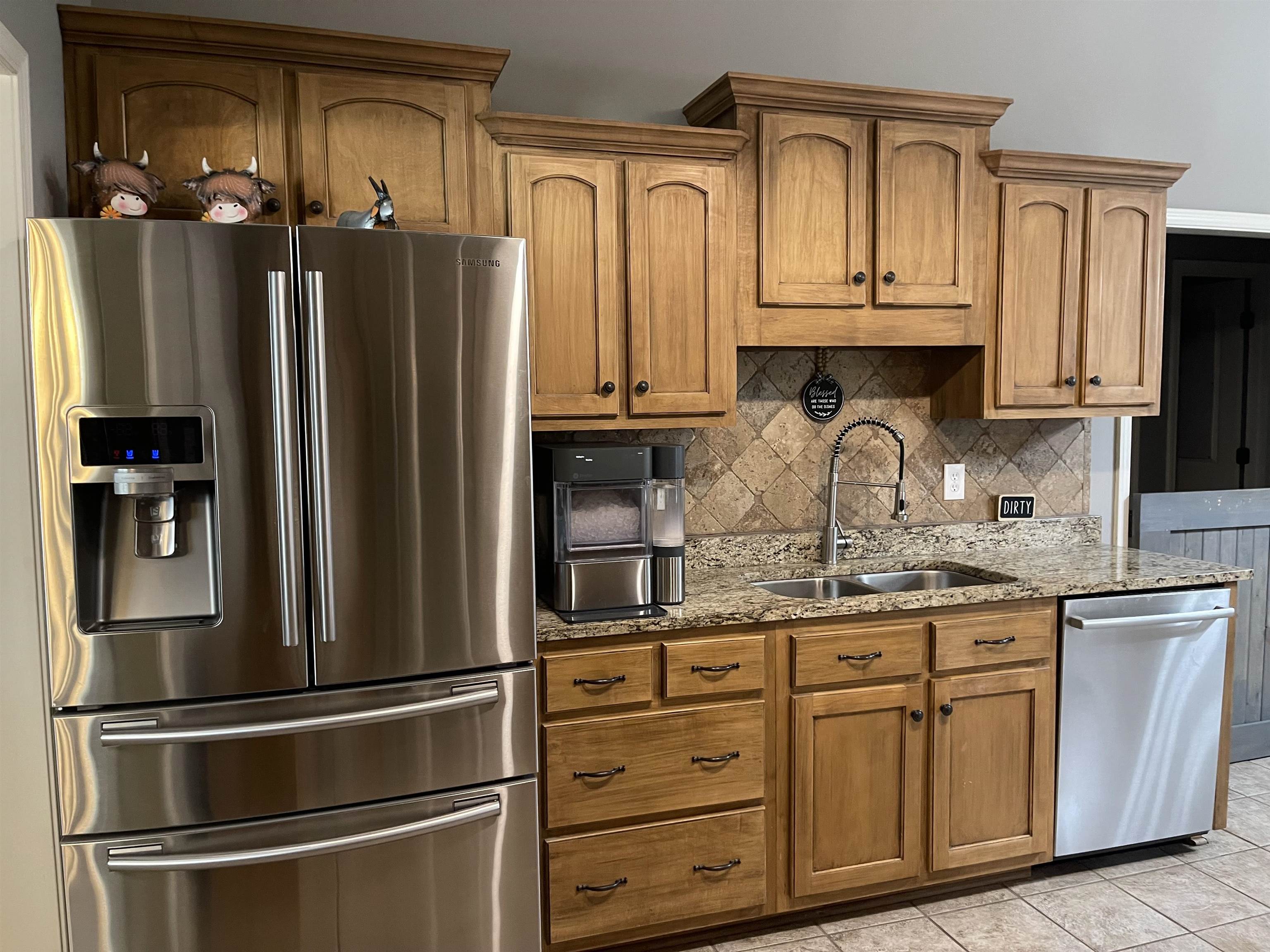 60 Mulberry Cove Oakland, TN 38060 - Photo 4 of 20 a kitchen with stainless steel appliances granite countertop a refrigerator and cabinets