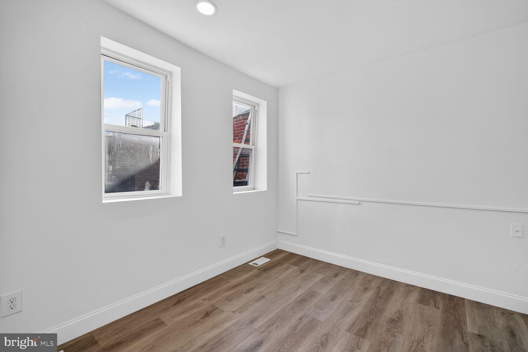 2409 18th Street Northwest, Unit 2 Washington, DC 20009 - Photo 19 of 19 wooden floor in an empty room