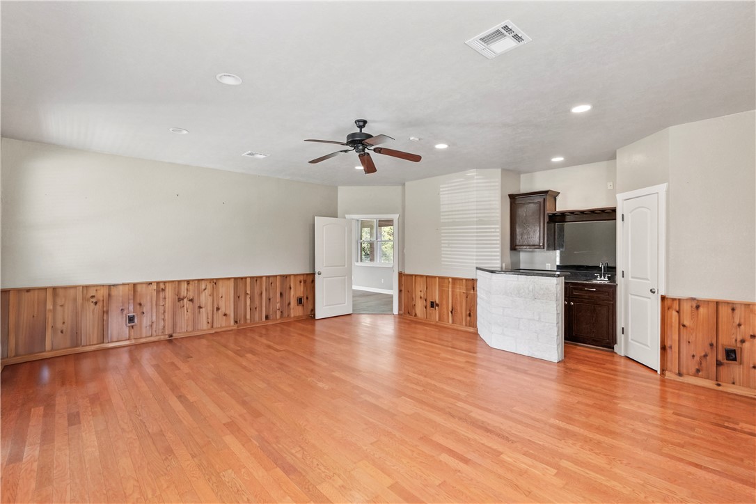 6701 Old Reliance Road Bryan, TX 77808 - Photo 15 of 44 a view of kitchen with cabinets and wooden floor