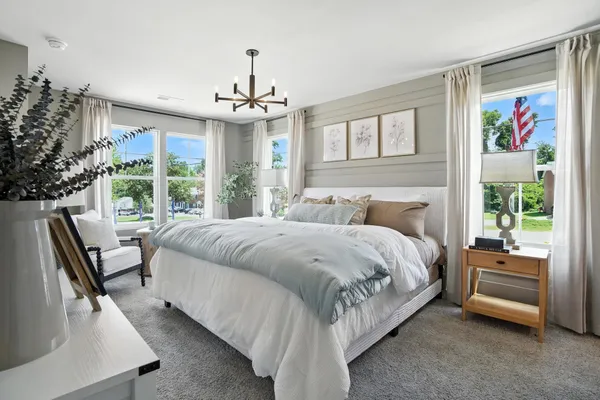 a spacious bedroom with a large bed and a couch