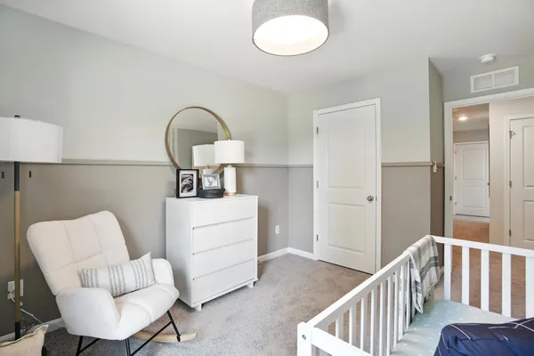 a bedroom with furniture and a window