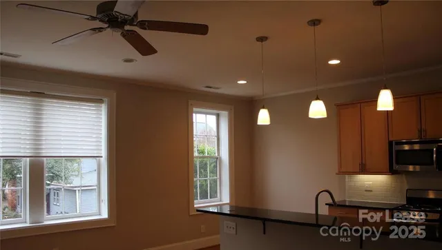 a view of kitchen with furniture and window