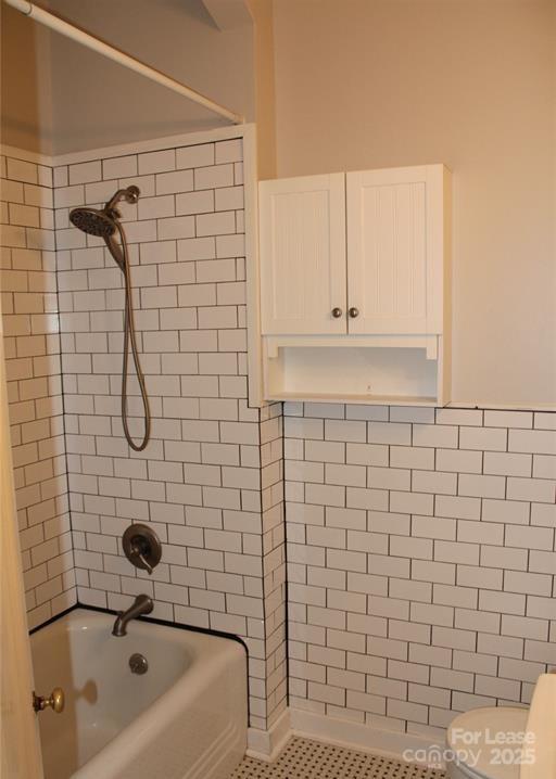 178 Union Street South, Unit 10 Concord, NC 28025 - Photo 6 of 7 a bathroom with a sink a toilet and shower