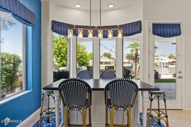 a front view of a house with a garden and patio