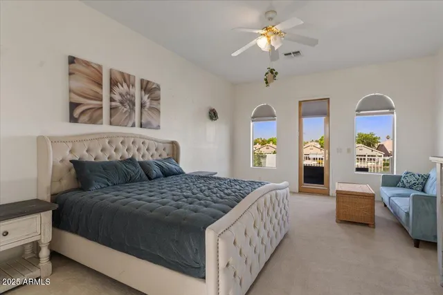 an aerial view of a house with yard swimming pool and lake view