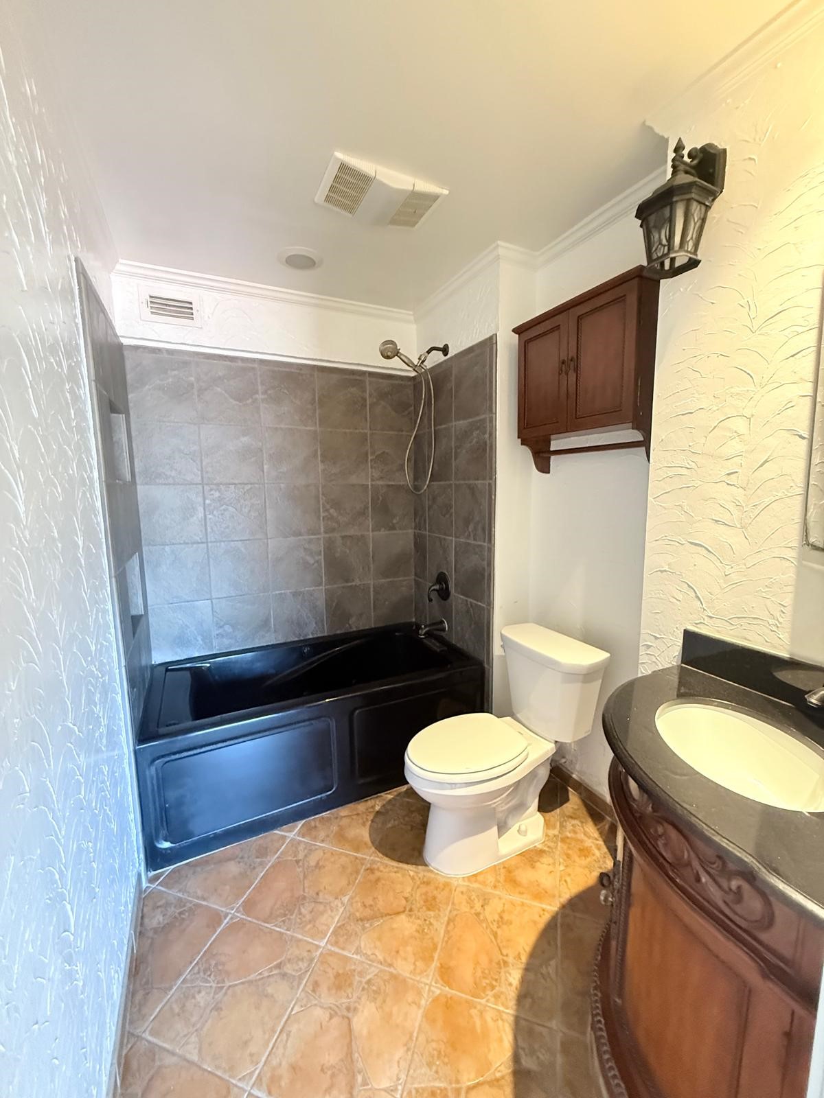 8287 Sands Point Drive, Unit 128 Houston, TX 77036 - Photo 13 of 30 a bathroom with a sink toilet and shower
