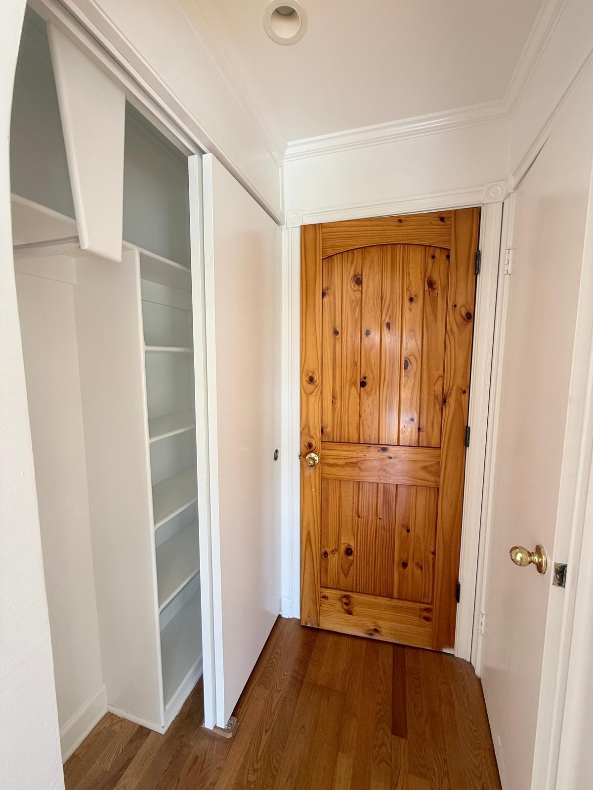8287 Sands Point Drive, Unit 128 Houston, TX 77036 - Photo 17 of 30 a view of a hallway with wooden floor