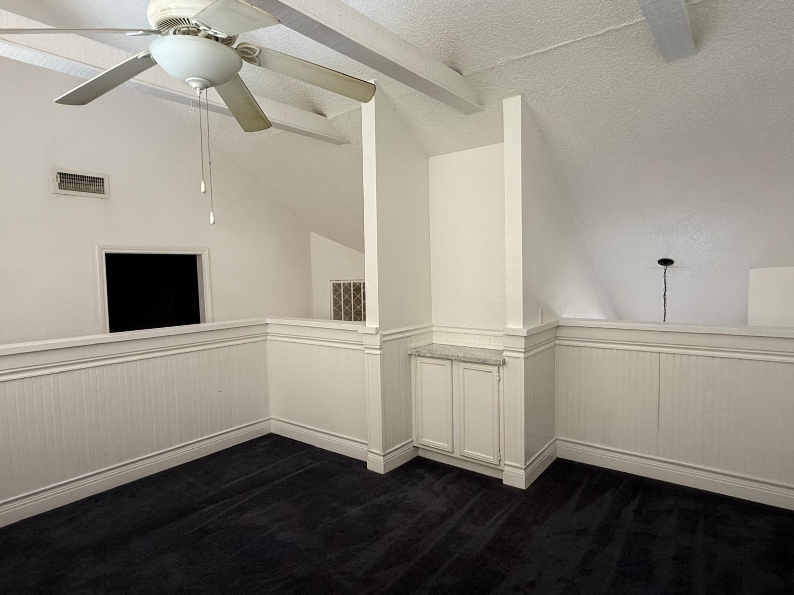 8287 Sands Point Drive, Unit 128 Houston, TX 77036 - Photo 28 of 30 a view of an empty room with wooden floor and a window