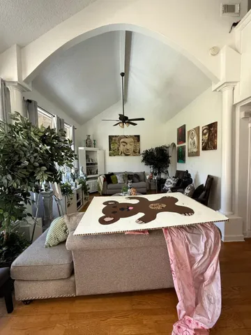a living room with furniture and a fireplace