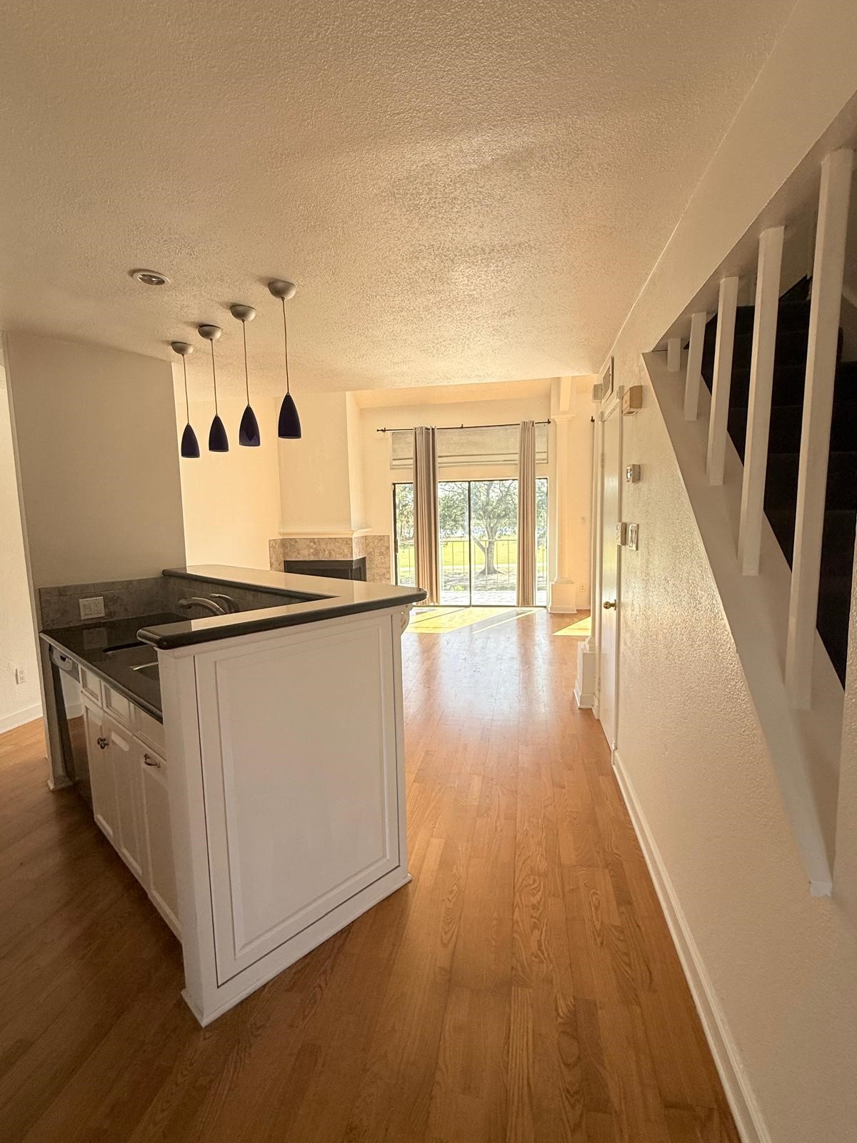 8287 Sands Point Drive, Unit 128 Houston, TX 77036 - Photo 5 of 30 a view of a kitchen with wooden floor and electronic appliances