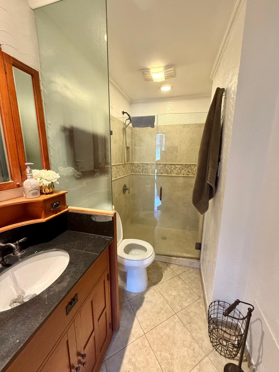 8287 Sands Point Drive, Unit 182 Houston, TX 77036 - Photo 5 of 8 a bathroom with a granite countertop sink toilet and shower