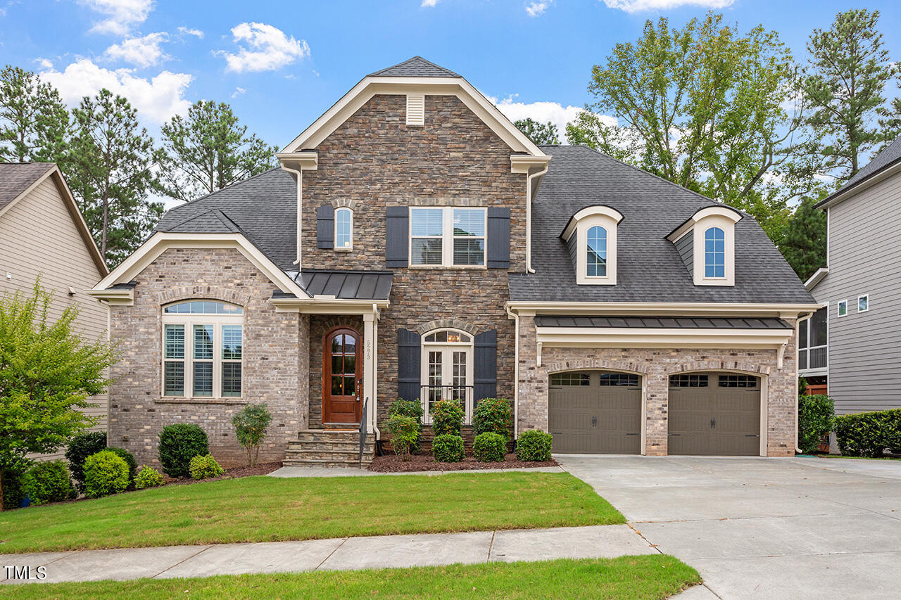 5273 Aleppo Lane Raleigh, NC 27613 - Photo 1 of 56 a front view of a house with a yard