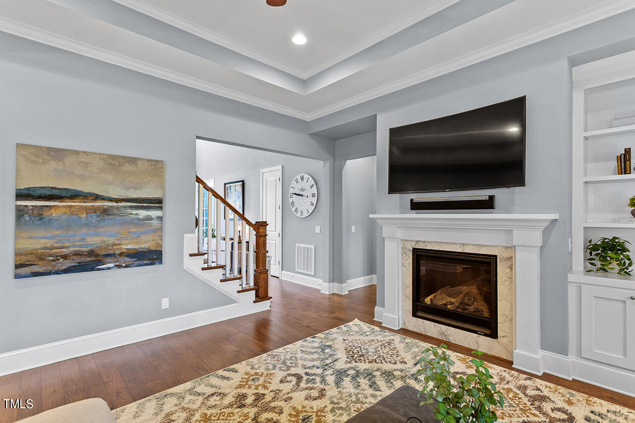 5273 Aleppo Lane Raleigh, NC 27613 - Photo 17 of 56 a living room with furniture and a fireplace