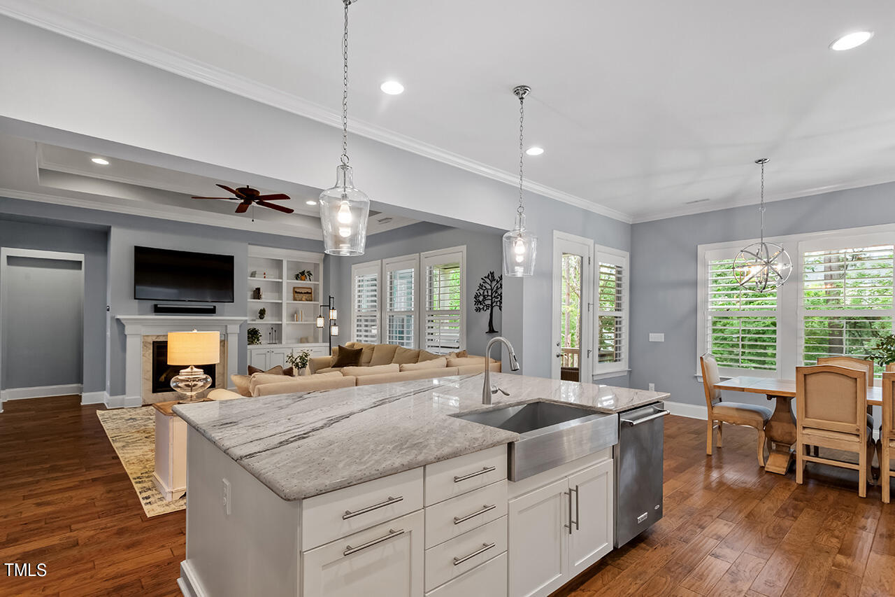 5273 Aleppo Lane Raleigh, NC 27613 - Photo 20 of 56 a large kitchen with kitchen island a large island in it