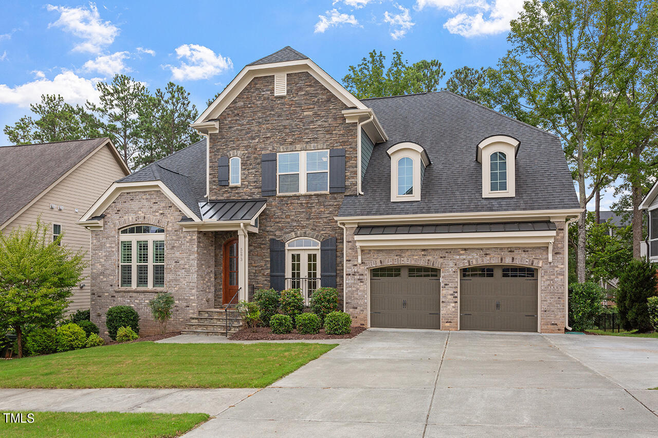 5273 Aleppo Lane Raleigh, NC 27613 - Photo 2 of 56 a front view of a house with a garden