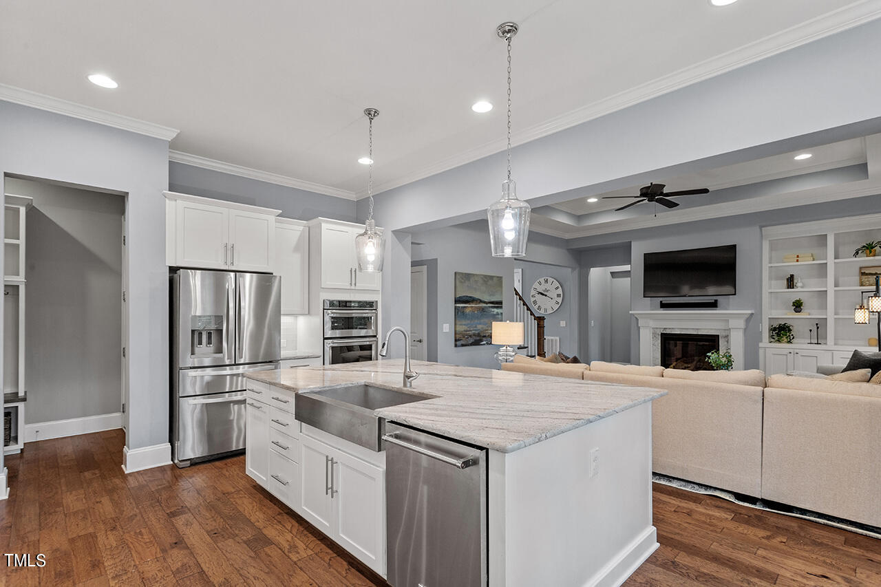 5273 Aleppo Lane Raleigh, NC 27613 - Photo 22 of 56 a kitchen with stainless steel appliances a refrigerator and a stove top oven