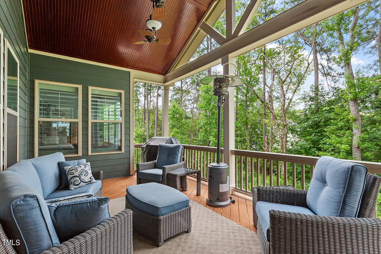 5273 Aleppo Lane Raleigh, NC 27613 - Photo 26 of 56 a balcony with furniture and a potted plant