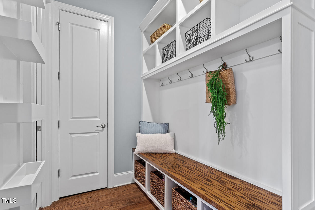 5273 Aleppo Lane Raleigh, NC 27613 - Photo 27 of 56 a view of hallway with furniture and wooden floor