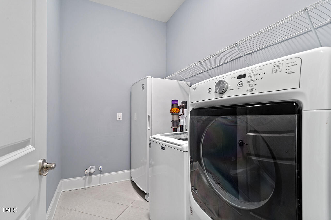 5273 Aleppo Lane Raleigh, NC 27613 - Photo 28 of 56 a utility room with dryer and washer