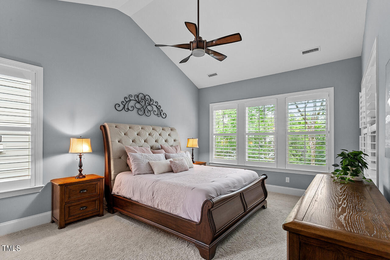 5273 Aleppo Lane Raleigh, NC 27613 - Photo 29 of 56 a bed room with a bed and a couch