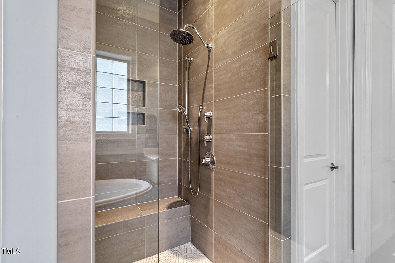 5273 Aleppo Lane Raleigh, NC 27613 - Photo 33 of 56 a bathroom with a shower and toilet