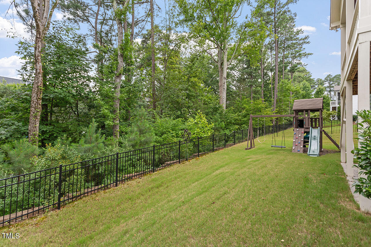 5273 Aleppo Lane Raleigh, NC 27613 - Photo 4 of 56 a view of a backyard with swimming pool