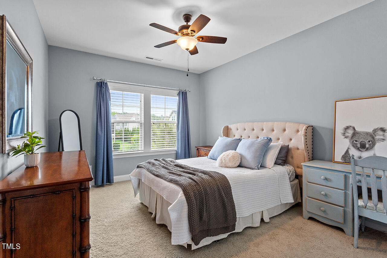 5273 Aleppo Lane Raleigh, NC 27613 - Photo 41 of 56 a bedroom with bed and window