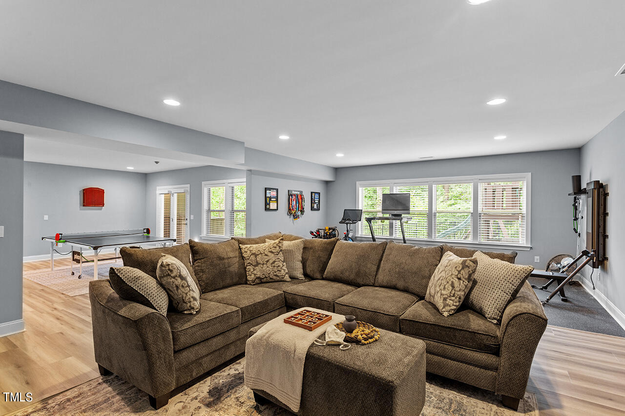5273 Aleppo Lane Raleigh, NC 27613 - Photo 47 of 56 a living room with furniture and a large window
