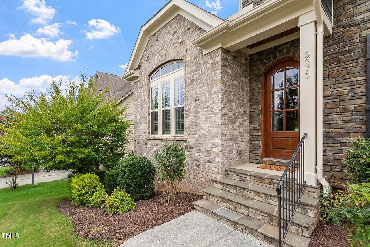 5273 Aleppo Lane Raleigh, NC 27613 - Photo 8 of 56 a front view of a house with garden