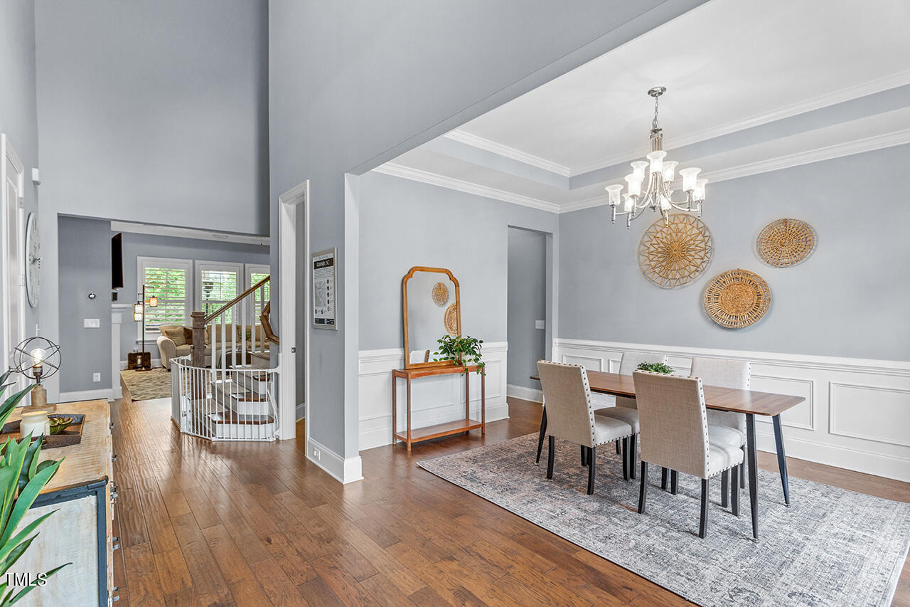 5273 Aleppo Lane Raleigh, NC 27613 - Photo 9 of 56 a view of a dining room with furniture and chandelier