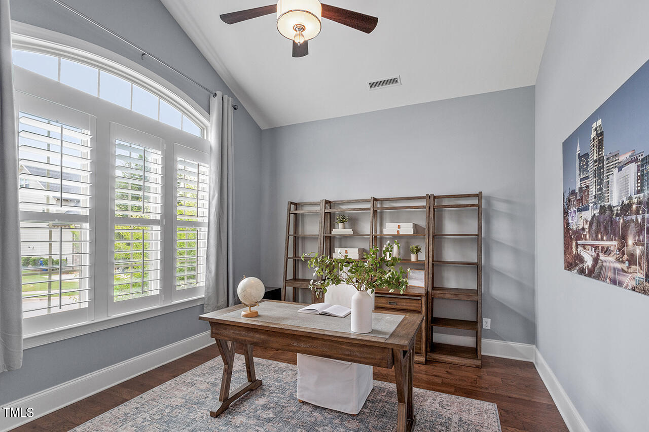 5273 Aleppo Lane Raleigh, NC 27613 - Photo 10 of 56 a view of a workspace with furniture and a window