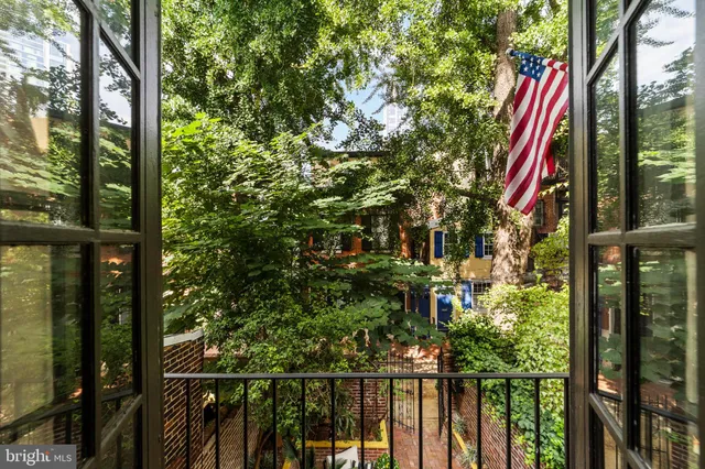 a view of a house with a tree