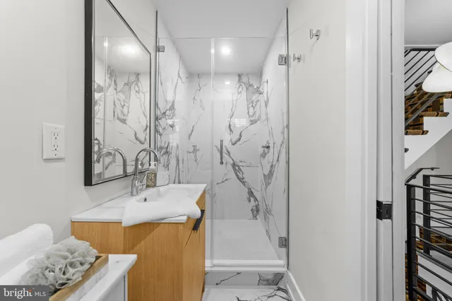 a bathroom with a tub sink and shower
