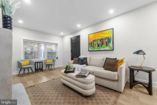 a living room with furniture and a table
