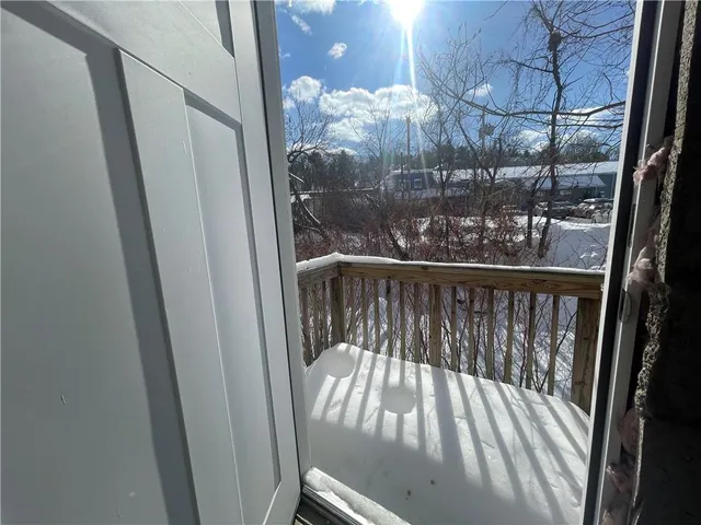a view of balcony with wooden floor