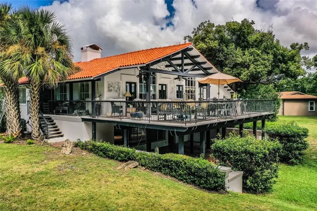 a front view of a house with a yard table and chairs