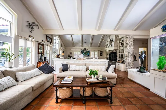 a kitchen with stainless steel appliances granite countertop a refrigerator sink and stove