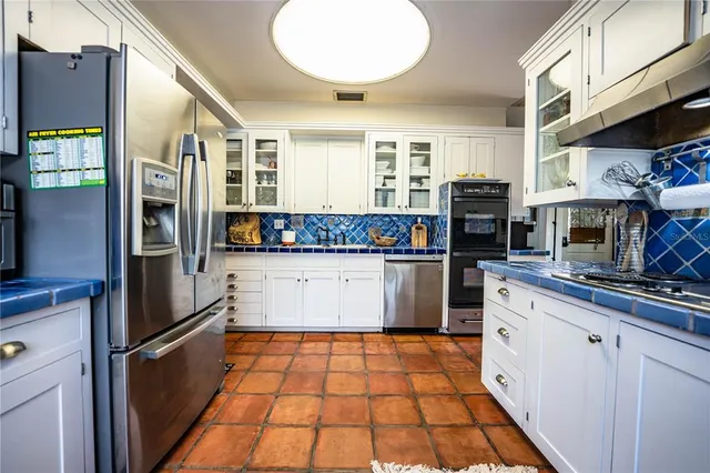 a bedroom with furniture and a flat screen tv