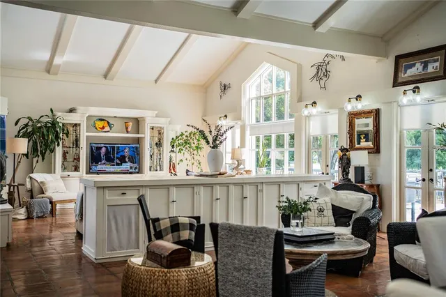 a living room with furniture or outdoor view and a large window