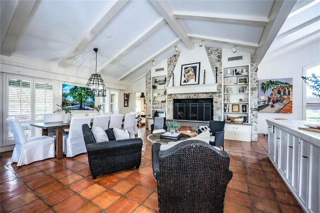 a dining room with furniture window and wooden floor