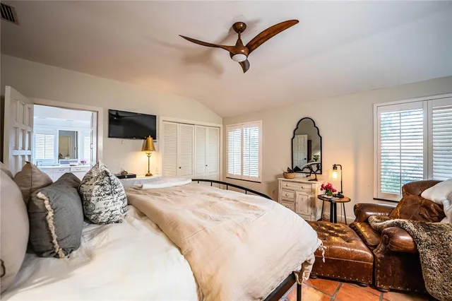 a bedroom with furniture and a window