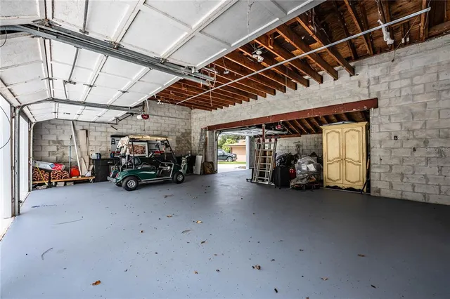a front view of a house with plants
